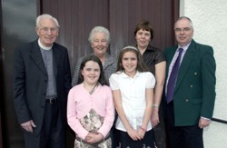 At the centenary service in Dunmurry are Select Vestry member Alan Houston with his wife Brenda and their daughters Alannah and Joelle.  The couple was married in the parish in 1980 during the ministry of the Rev Canon Terry Rodgers (left) who is pictured with his wife Lorna.  
